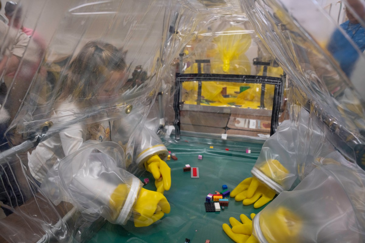 Child-friendly interactive displays available during Family Days included glovebox mock simulators used to manipulate Legos in a controlled environment.