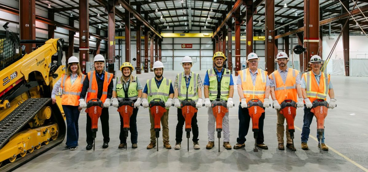 SRNS identified subcontractor Kiewit to kick off the early construction scope for the High-Fidelity Training and Operations Center (HFTOC) subproject. Representatives from SRNS and Kiewit are pictured with jackhammers inside the existing HFTOC structure as the initial scope will include replacement of the concrete flooring and other external and internal building modifications.
