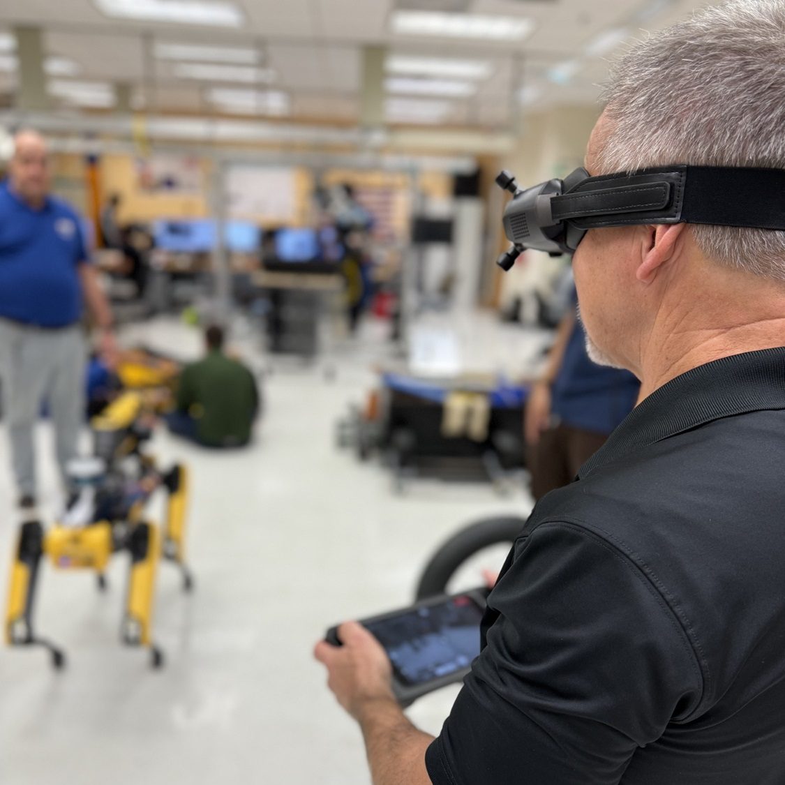 SRNS Director of Engineering Technical Services, Ken Burrows, tests out the Boston Dynamics Robot nicknamed ‘Spot,’ showcasing cutting-edge technology being integrated into DOE projects.