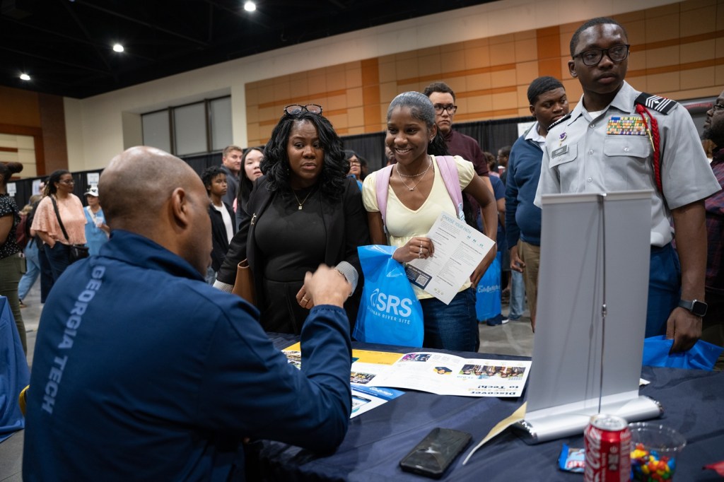 College recruiters from the Georgia Institute of Technology speak with attendees during CSRA College Night.
