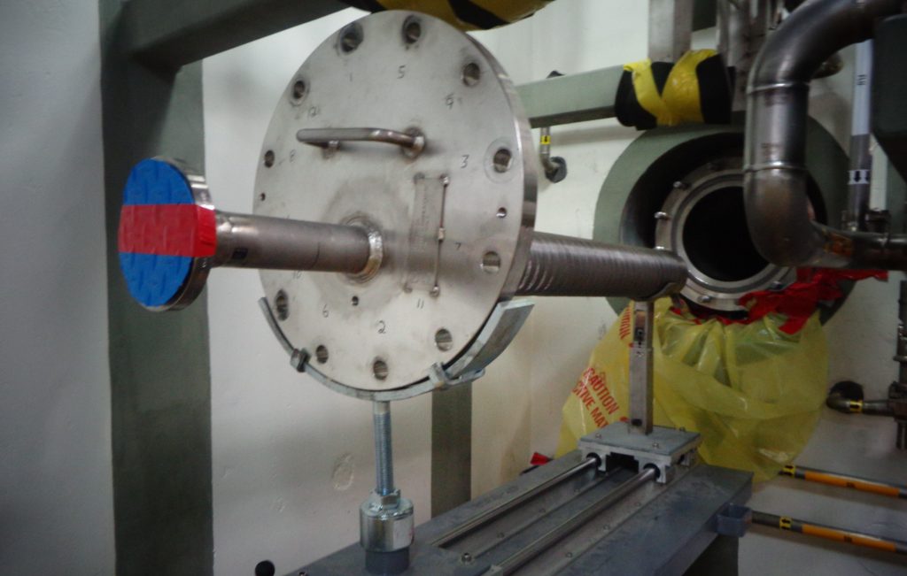 Pictured is the only part of the coalescer — the flange and coalescer media — that is visible; the coalescer vessel is inside a radiological cell.