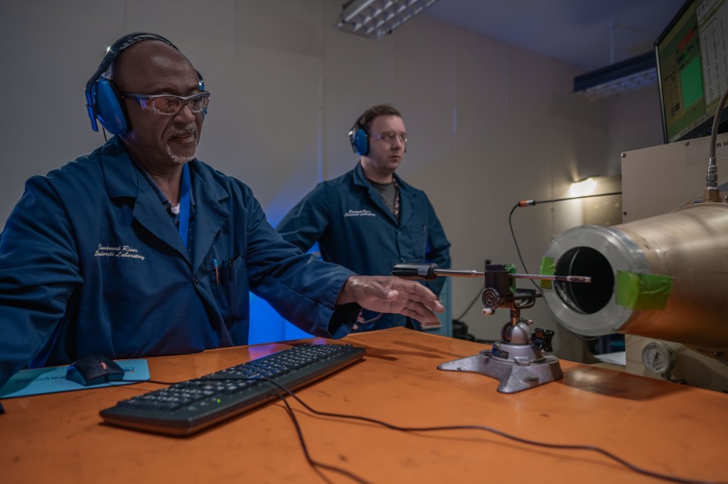 Metrologists Nathan Shipman and Justen Brooks calibrate an anemometer.