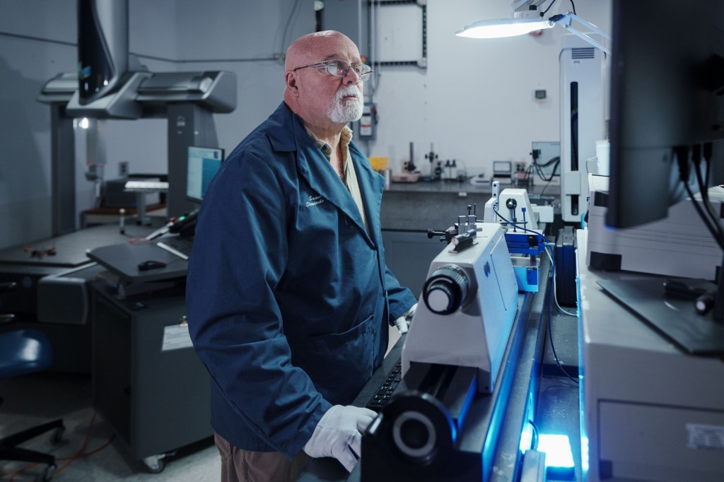 Metrologist Charles Allocco performs a thread diameter calibration.
